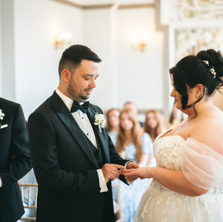 Real Wedding Belles Love bride wearing a lace wedding dress with off the shoulder sleeves.