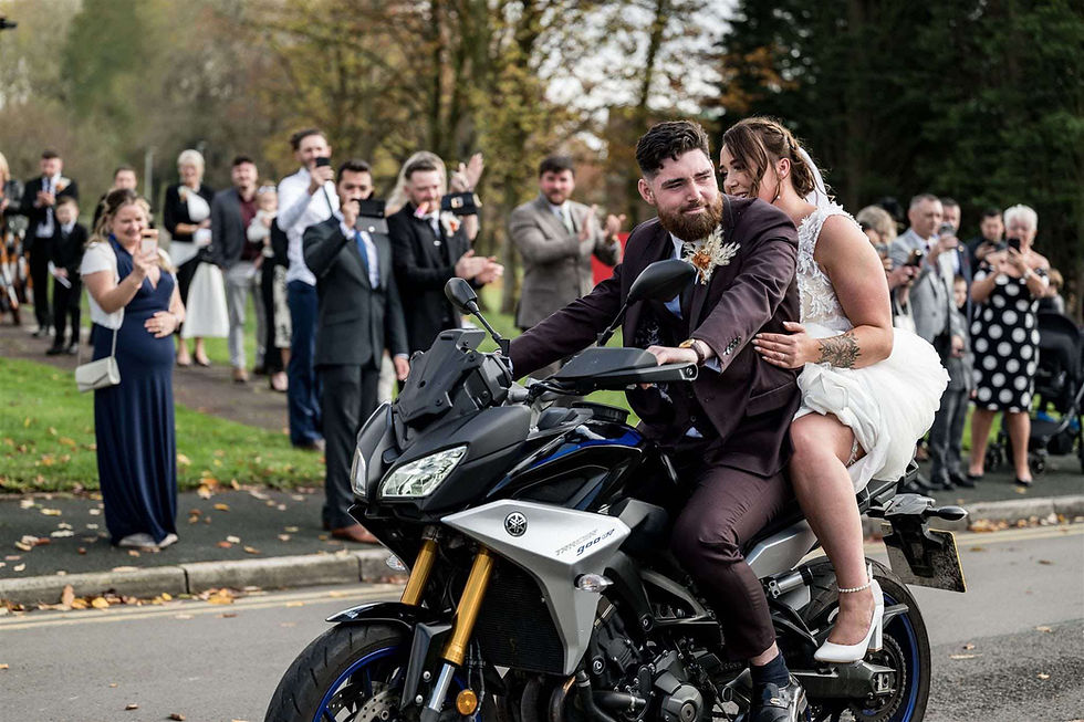 Bride wearing a Casablanca Bridal princess style wedding dress with a full tulle skirt and 3D floral details.