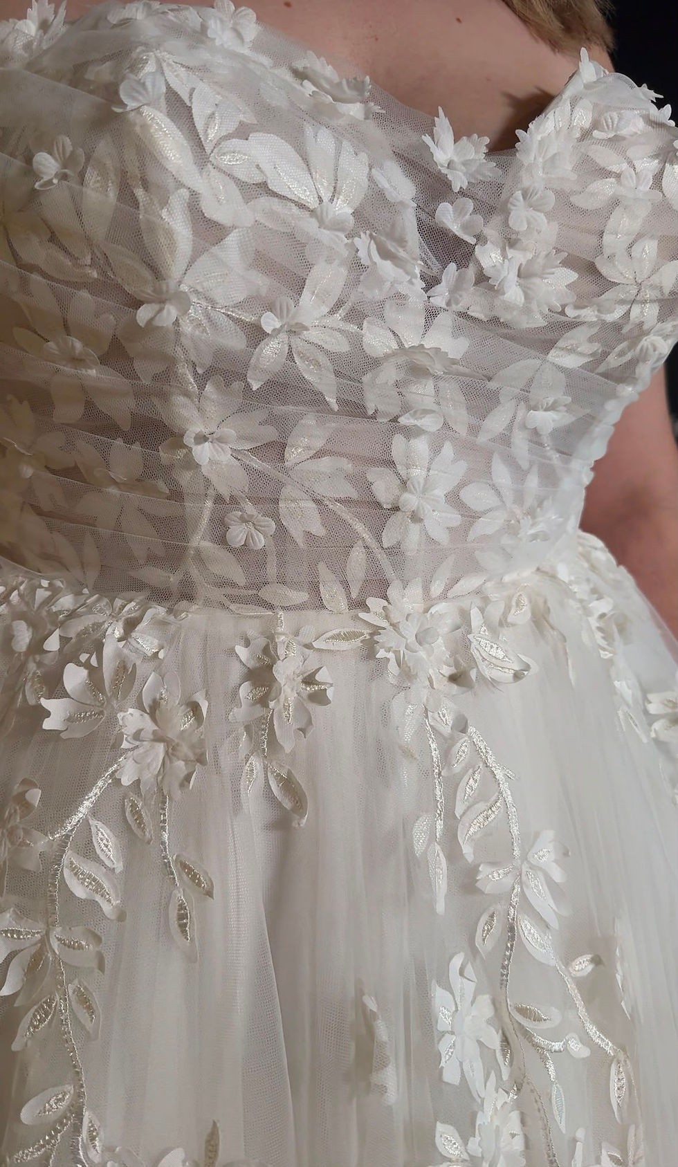 Bride discovering the perfect silhouette for her wedding day.