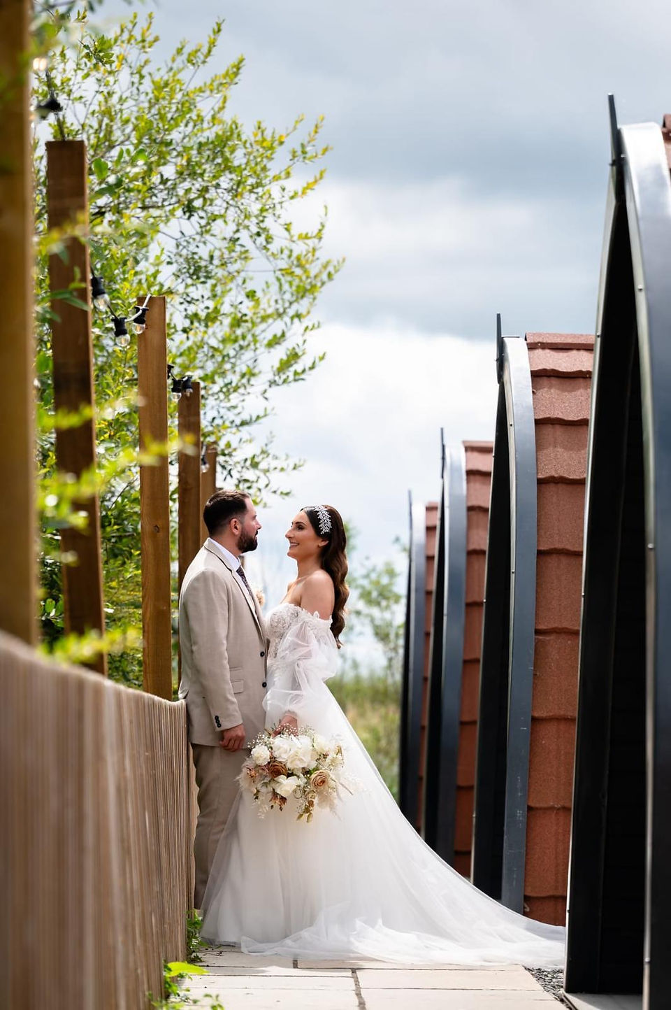 Bride wearing a timeless Stella York wedding dress with a structured bodice and flowing skirt.