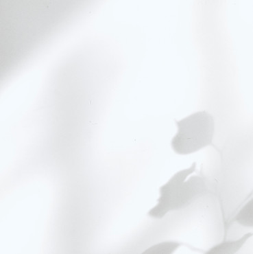 Picture of a woman smelling a flower