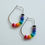 Thumbnail: Oval Hoop Earrings in Silver with Recycled Rainbow Disc Beads