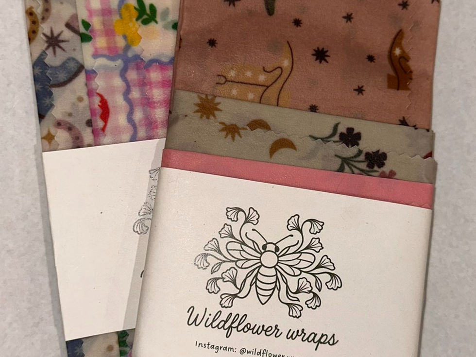 Five-pack of reusable beeswax wraps in mixed patterns, packaged with Wildflower Wraps branding