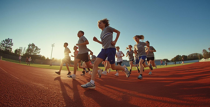 create a picture of kids and high school running track.jpg