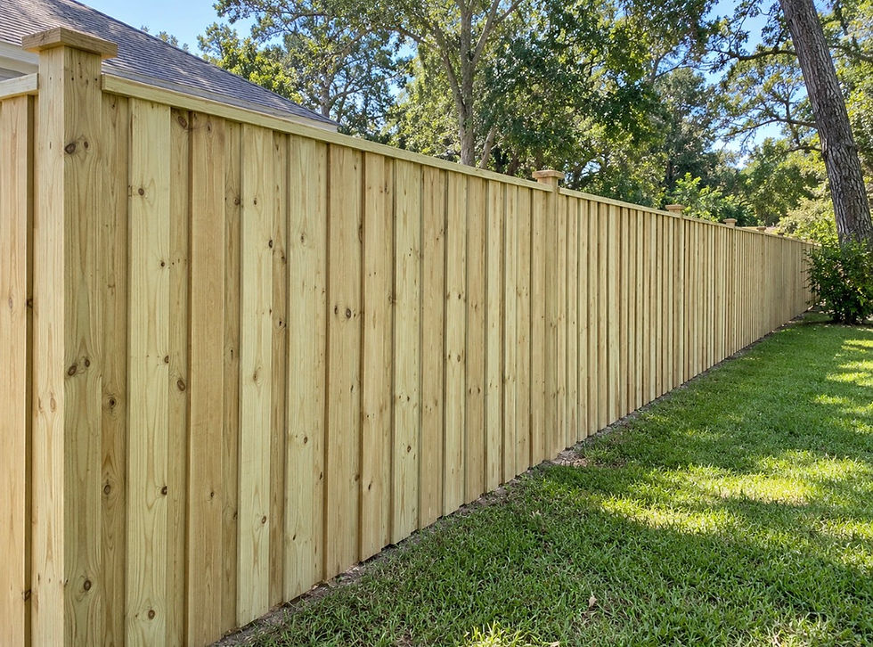 Boar-on-board wood fence installation around residential home