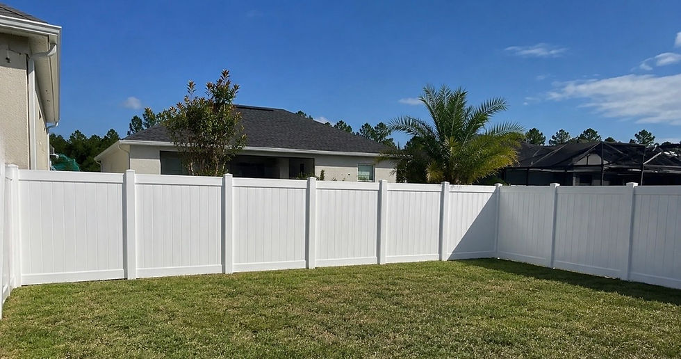 White vinyl privacy fence installed on a North Florida residential property.