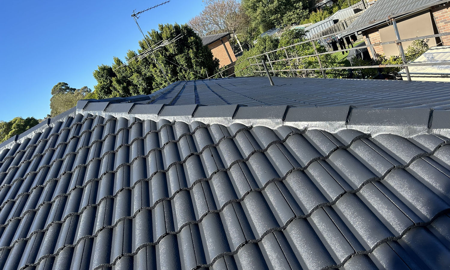 Completed charcoal tile roof restoration on a Melbourne home