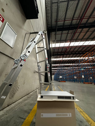Business network switch installation inside a Derrimut warehouse facility during IT infrastructure deployment