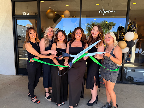 Team Image in front of the Salon at our 15 year anniversary party