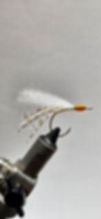Hand tied flies for surf fishing for pompano on a hook