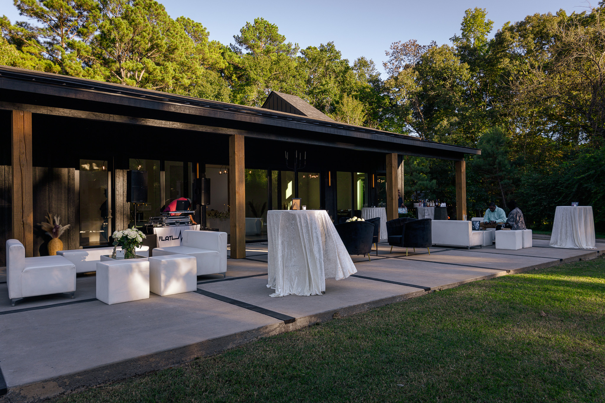 Covered terrace with lounge seating and cocktail tables