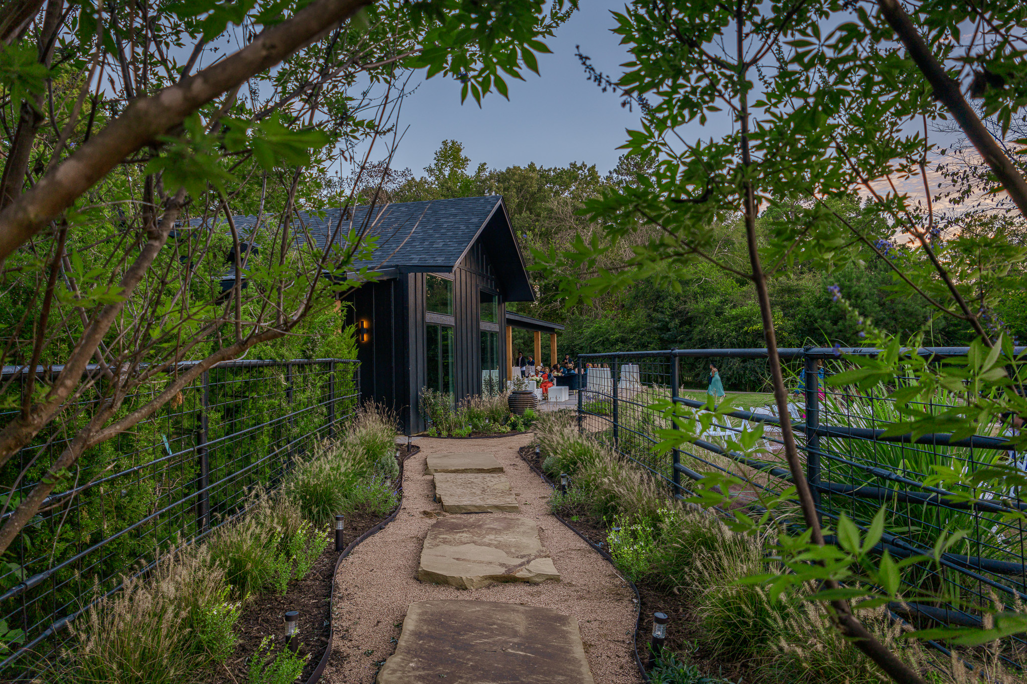 Stone garden walkway leading to the wedding venue