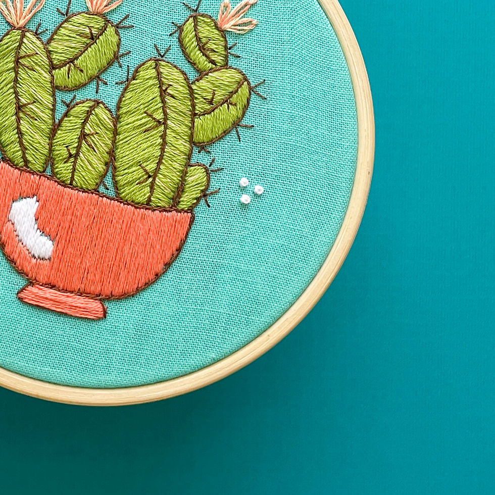 Thumbnail: Embroidery project featuring a green cactus with brown spikes and peach flowers in a dark peach pot.