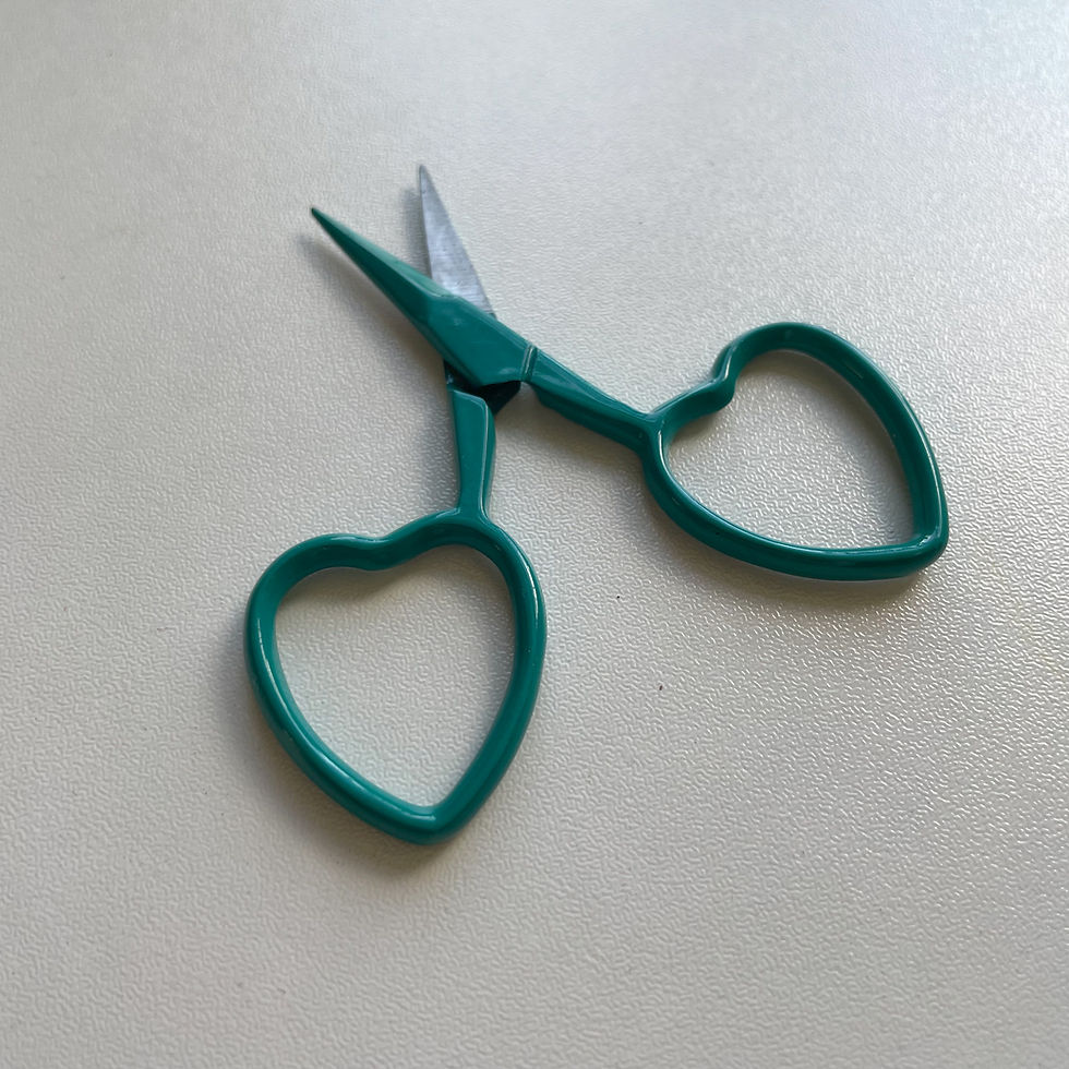 Thumbnail: Embroidery scissors in green with heart-shaped handles.