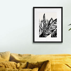 framed heliconia flower art print in living room setting