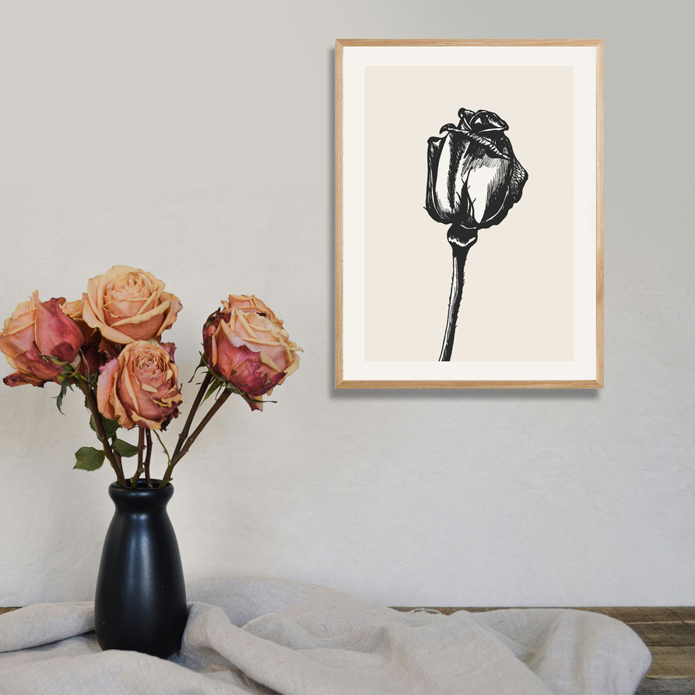 'Grace' art print framed on wall with vase of roses