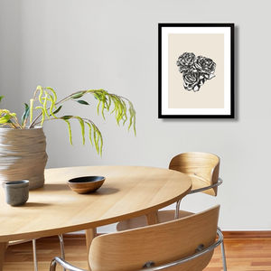 trio of roses art print in a neutral minimal composition and color. Mounted on wall in modern dining area.