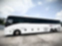 Side image of white coach of Americas Tours Inc.