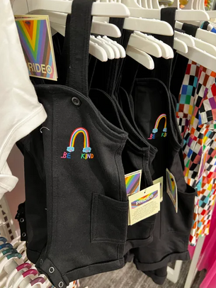Overalls for a toddler with a small rainbow on them