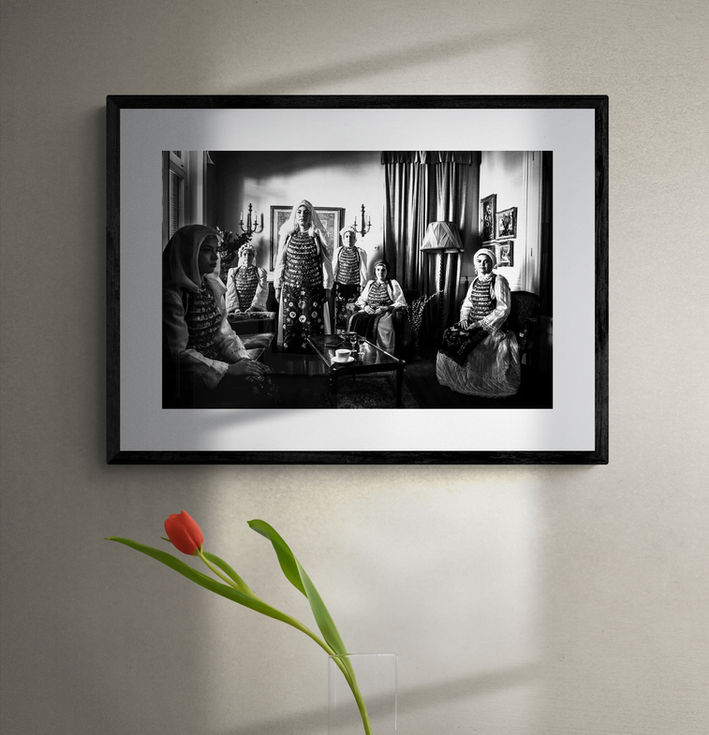 Atalanti Costumes print framed on a gray wall. Black-and-white photography by George Tatakis.