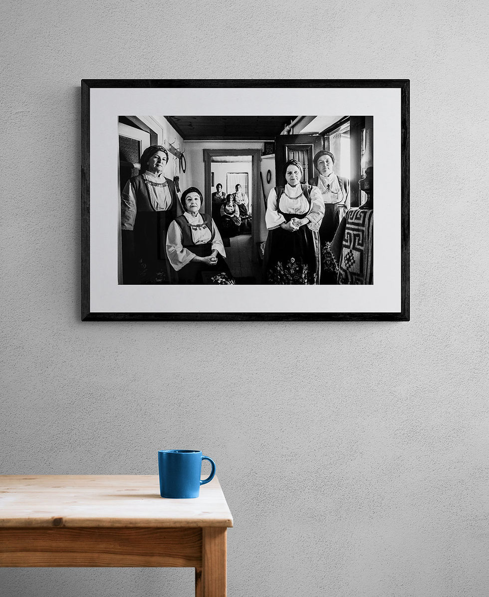 Μικρογραφία: Women of Ypati print framed on a white wall. Black-and-white photography by George Tatakis.