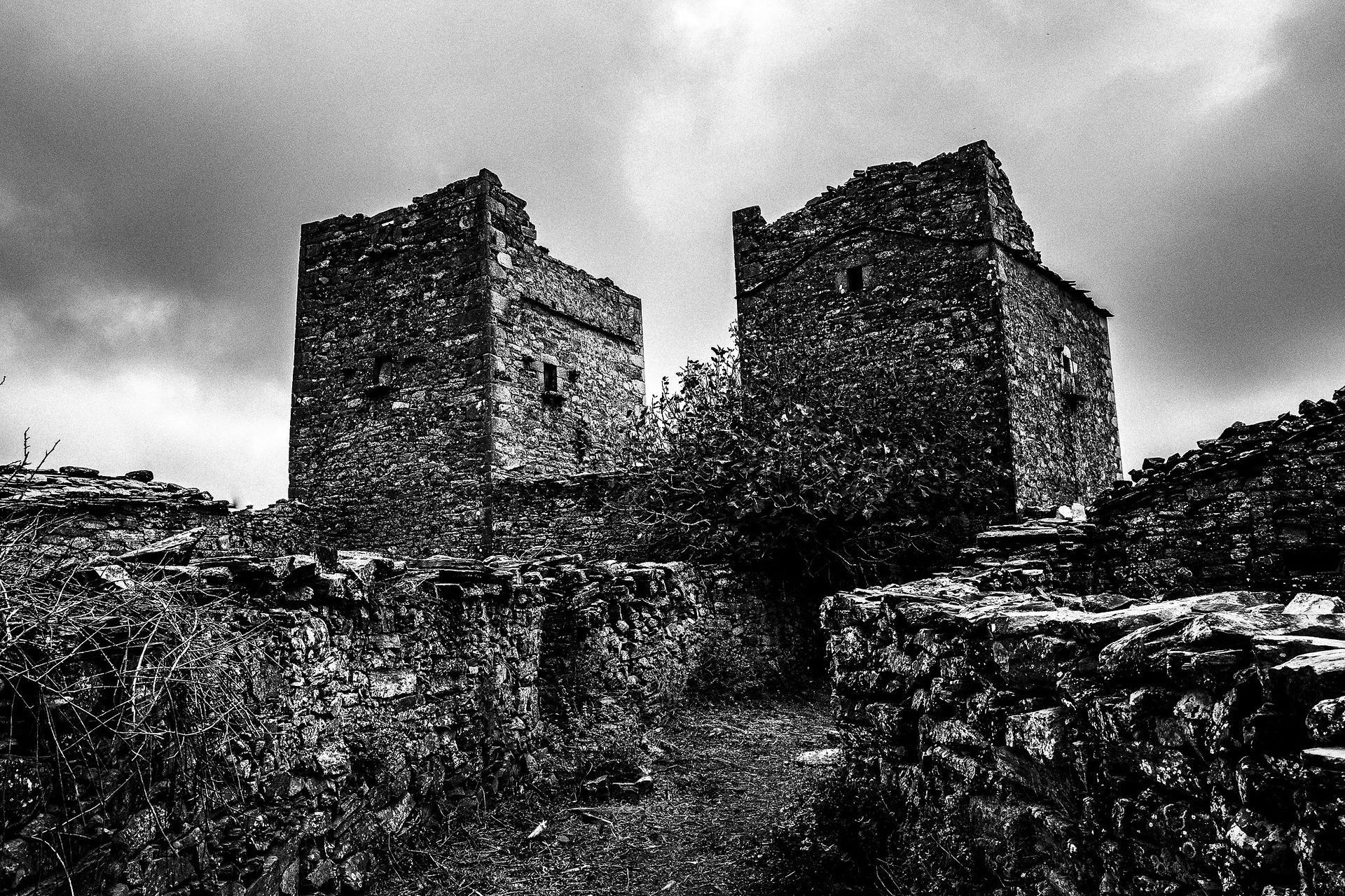 Towers at Mountanistika, Mani in the Peloponnese. Black and white photography by George Tatakis during the filming of 'Φόνισσα'(Fonissa).