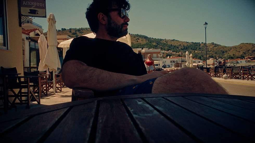 George Tatakis sitting by the sea at Marmaro, Kardamyla, the morning after the Chios exhibition opening.