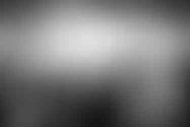 The ladies wearing the traditional costumes of Astypalaea, overlooking the town and the castle, by photographer George Tatakis