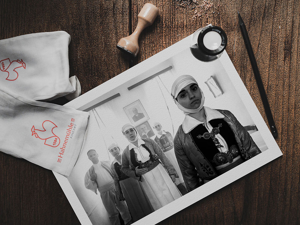 Family in House print on a table. Black-and-white photography by George Tatakis.