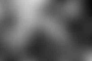 Three women sitting outside the main church. Olympos, Karpathos, Greece