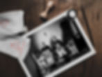 Holding Icons print on table. Black-and-white photography by George Tatakis.