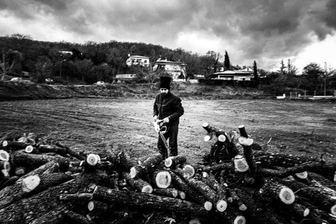 Building up the pile of woods, Pagan Christmas customs of Northern Greece, by photographer George Tatakis