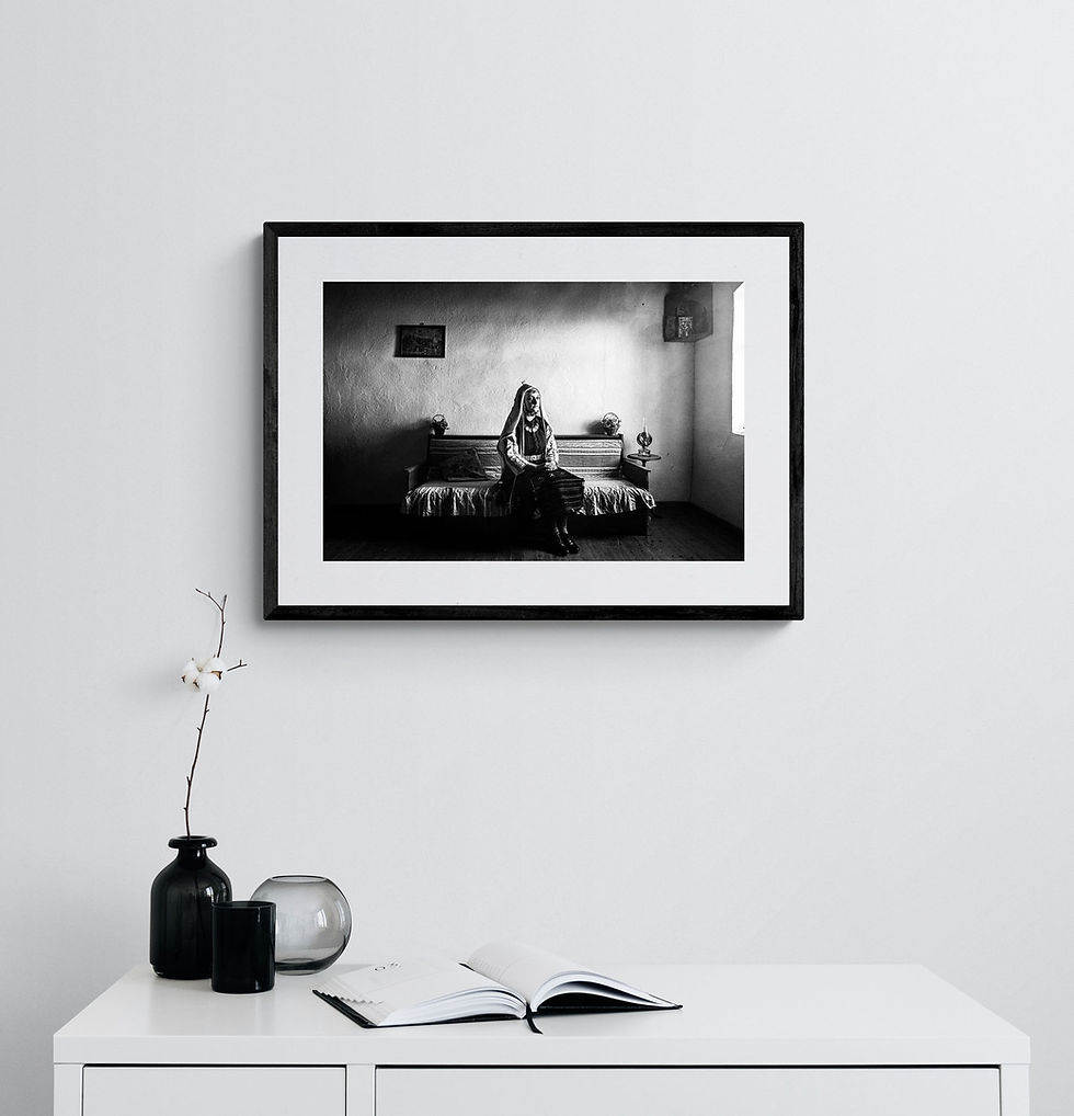 Μικρογραφία: Evros Lady Sitting print framed on a white wall. Black-and-white photography by George Tatakis.