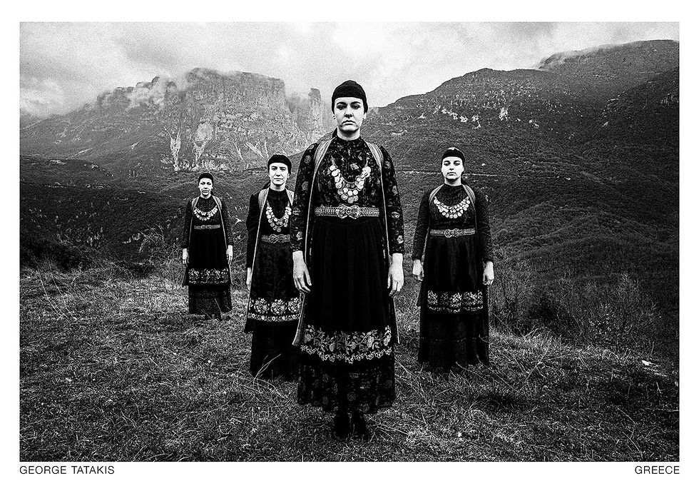 Four women wearing the local costumes of Zagori, Epirus, Greece. Black and white photography postcard by George Tatakis, project Caryatis.