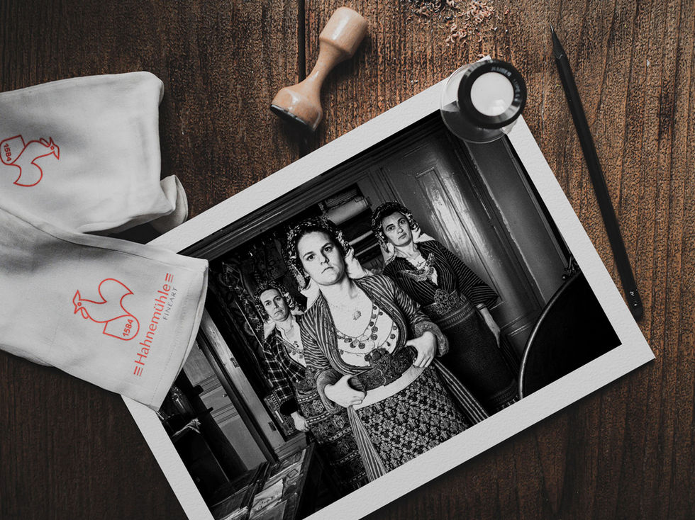 Three at Soufli on a table. Black-and-white photography wall are print by George Tatakis