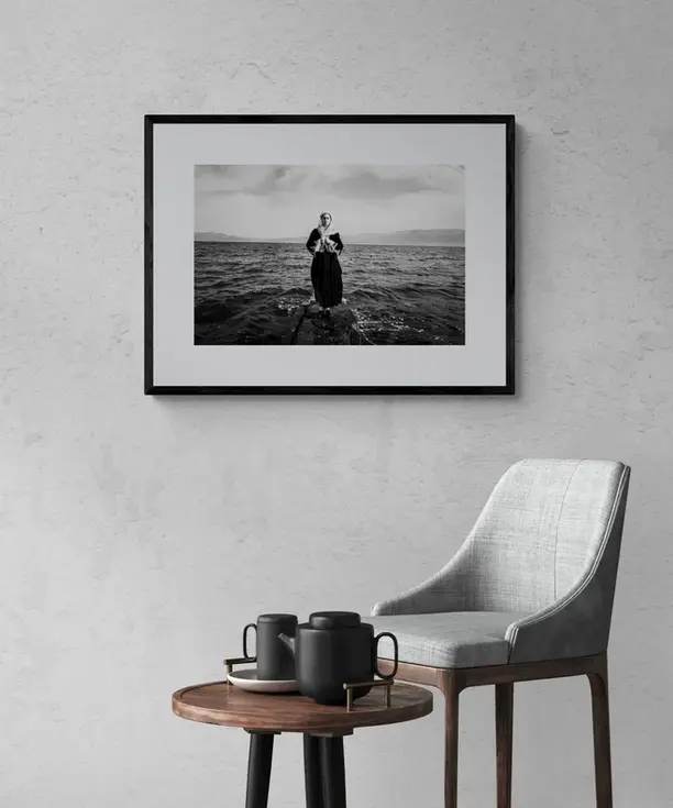 Kymi Pier Print framed on a white wall. Black-and-white photography by George Tatakis.
