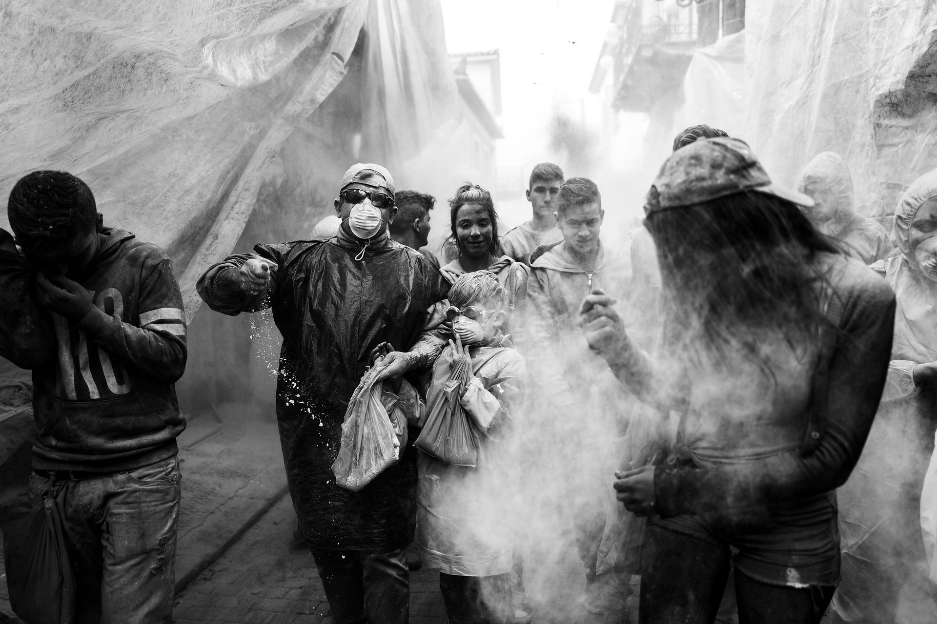 Young and old taking part at the flour wars in Galaxidi, by photographer George Tatakis