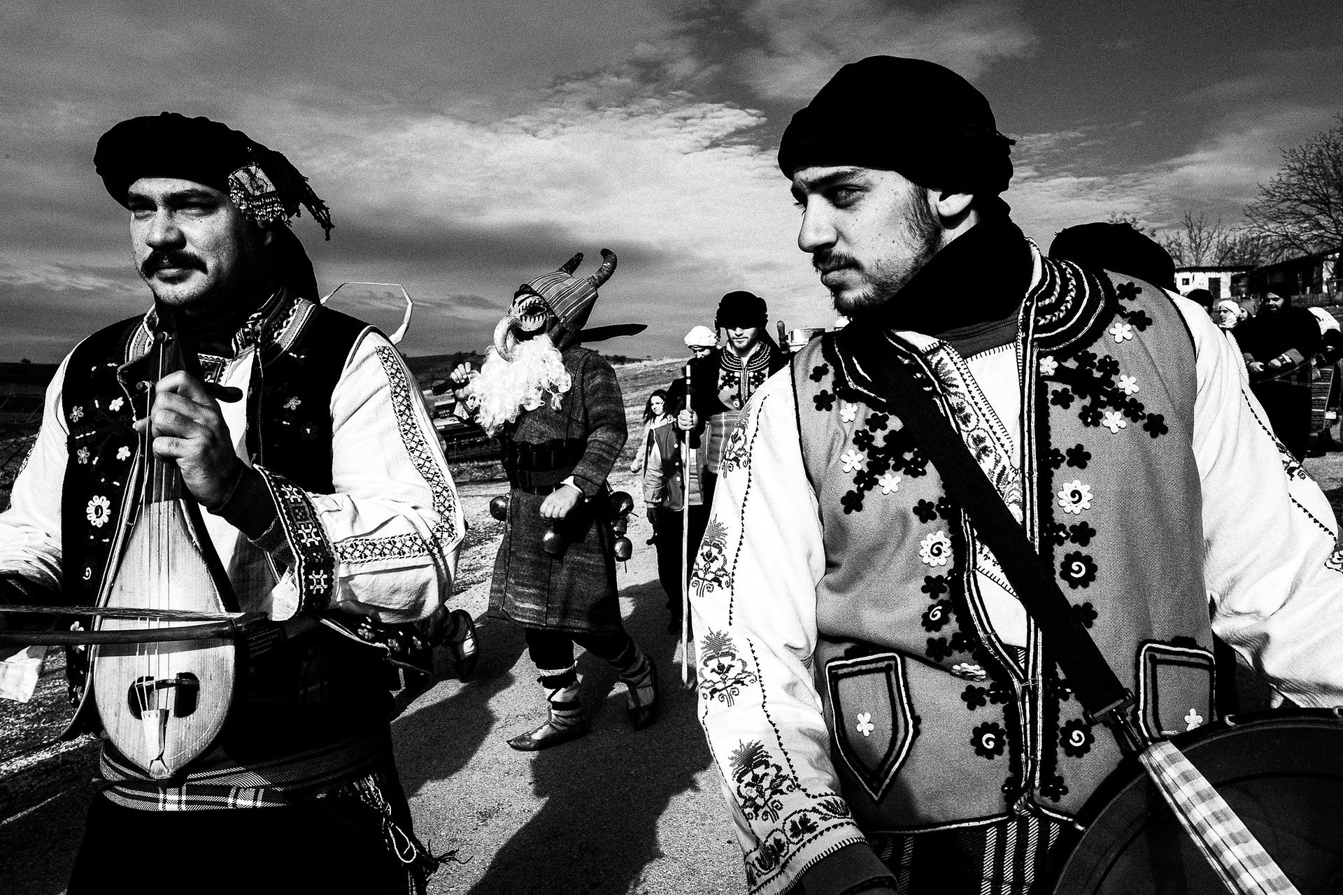 Purpuris with musicians, Pagan Christmas customs of Northern Greece, by photographer George Tatakis