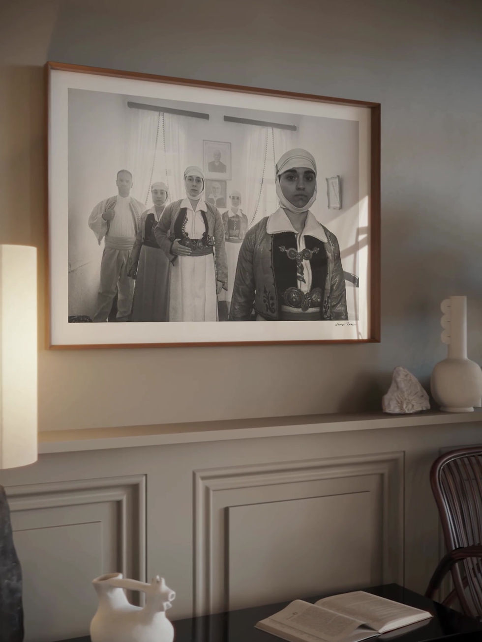 Thumbnail: Family in House print framed inside a living room. Black-and-white photography by George Tatakis.