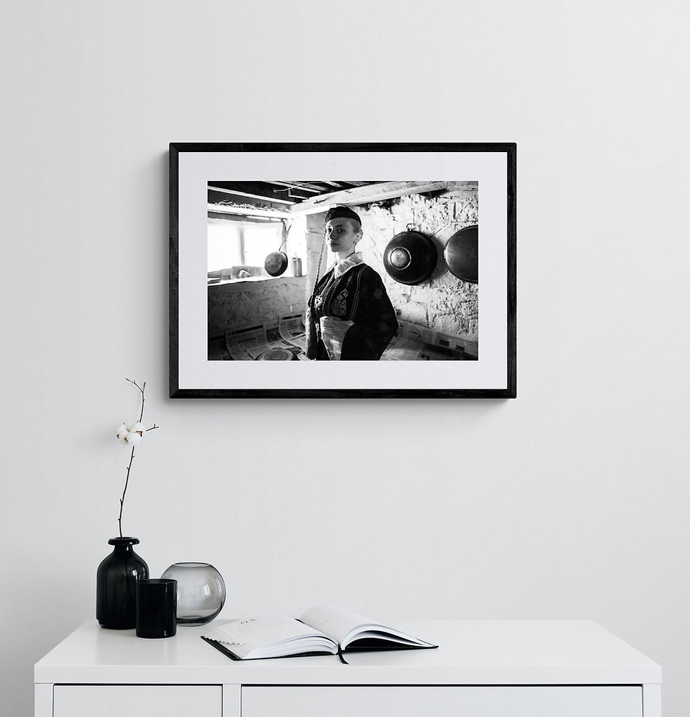 Μικρογραφία: Warehouse in Ioannina print framed on a white wall. Black-and-white photography by George Tatakis.