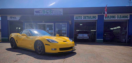yellow chevy corvette parked infront of bravo cleaning