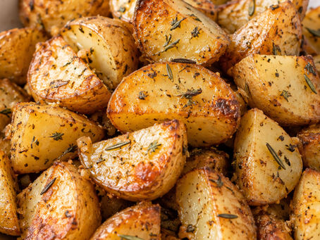 Quartered roasted gold potatoes seasoned with rosemary, thyme, garlic and black pepper