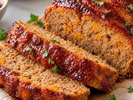 Hawaiian BBQ sweet potato meatloaf sliced and topped with a savory BBQ glaze.