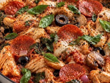 Crustless pizza chicken skillet with pepperoni, mozzarella, mushrooms, olives, spinach and fresh basil.