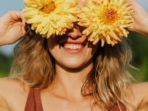 Woman happy after experiencing relief of migraines using acupuncture.