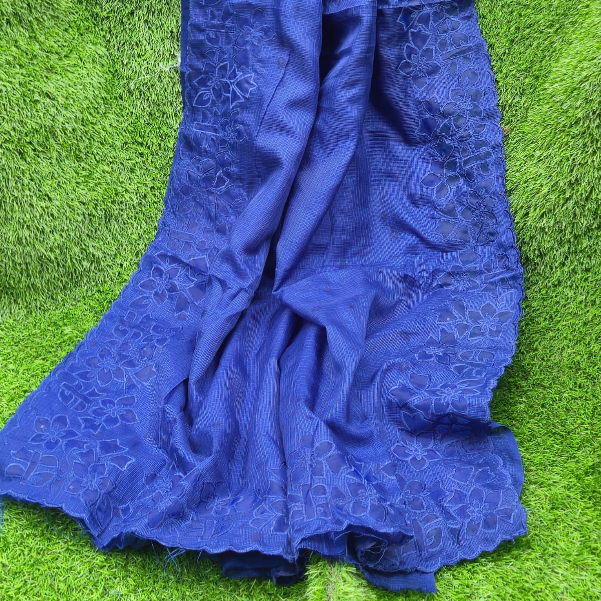 This beautiful blue soft Kota saree designed with intricate soft net applique work on the border and pallu