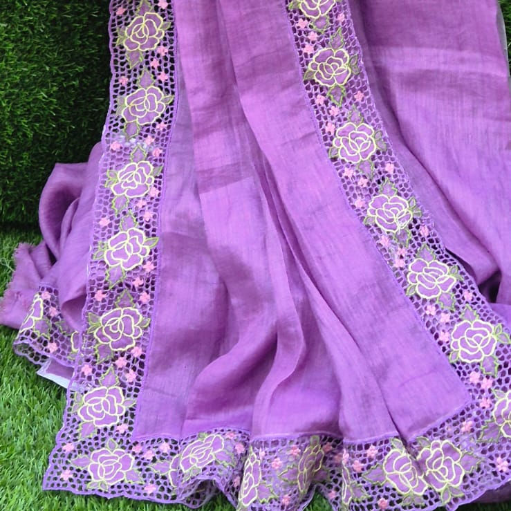 The saree features a continuous full border of decorative cutwork.