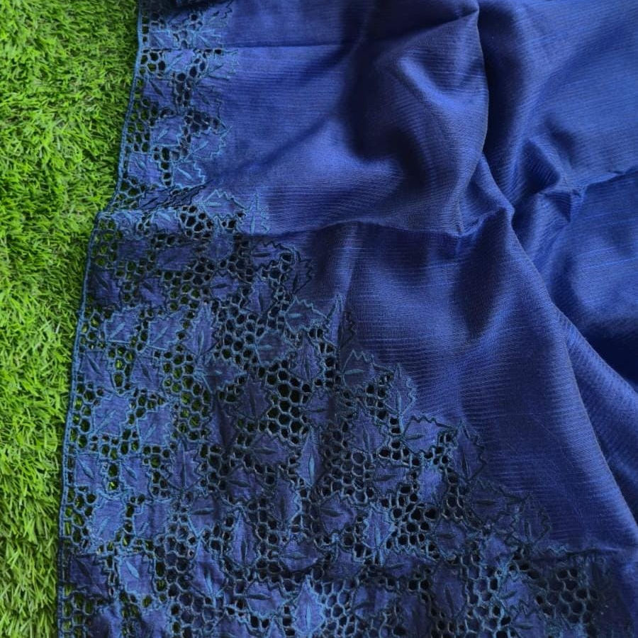 The saree is beautifully enhanced with an intricate full cutwork border that adds a touch of sophistication
