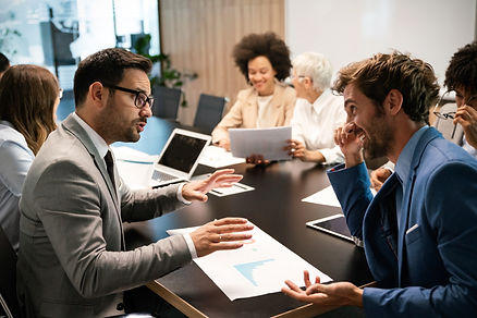portrait-of-successful-business-team-working-in-office.jpg