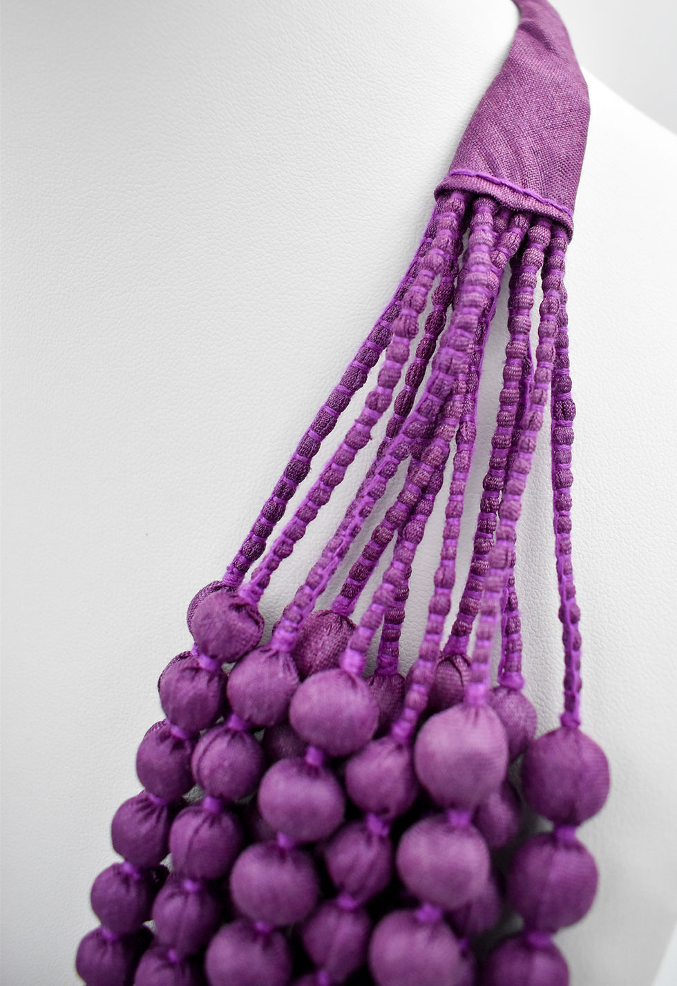 Thumbnail: Segment of a silk sari necklace meticulously  handcrafted by women.  A zero-waste product made from upcycled silk saris.